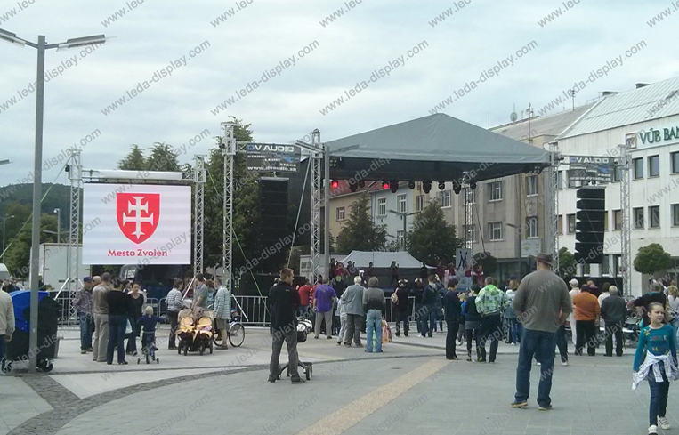 People gathered on the streets of Slovakia watching a vibrant LED rental display screen.