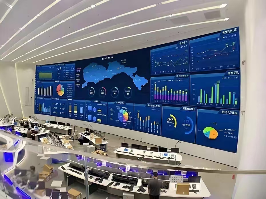 Large indoor LED display showing city population distribution data in a monitoring control center.